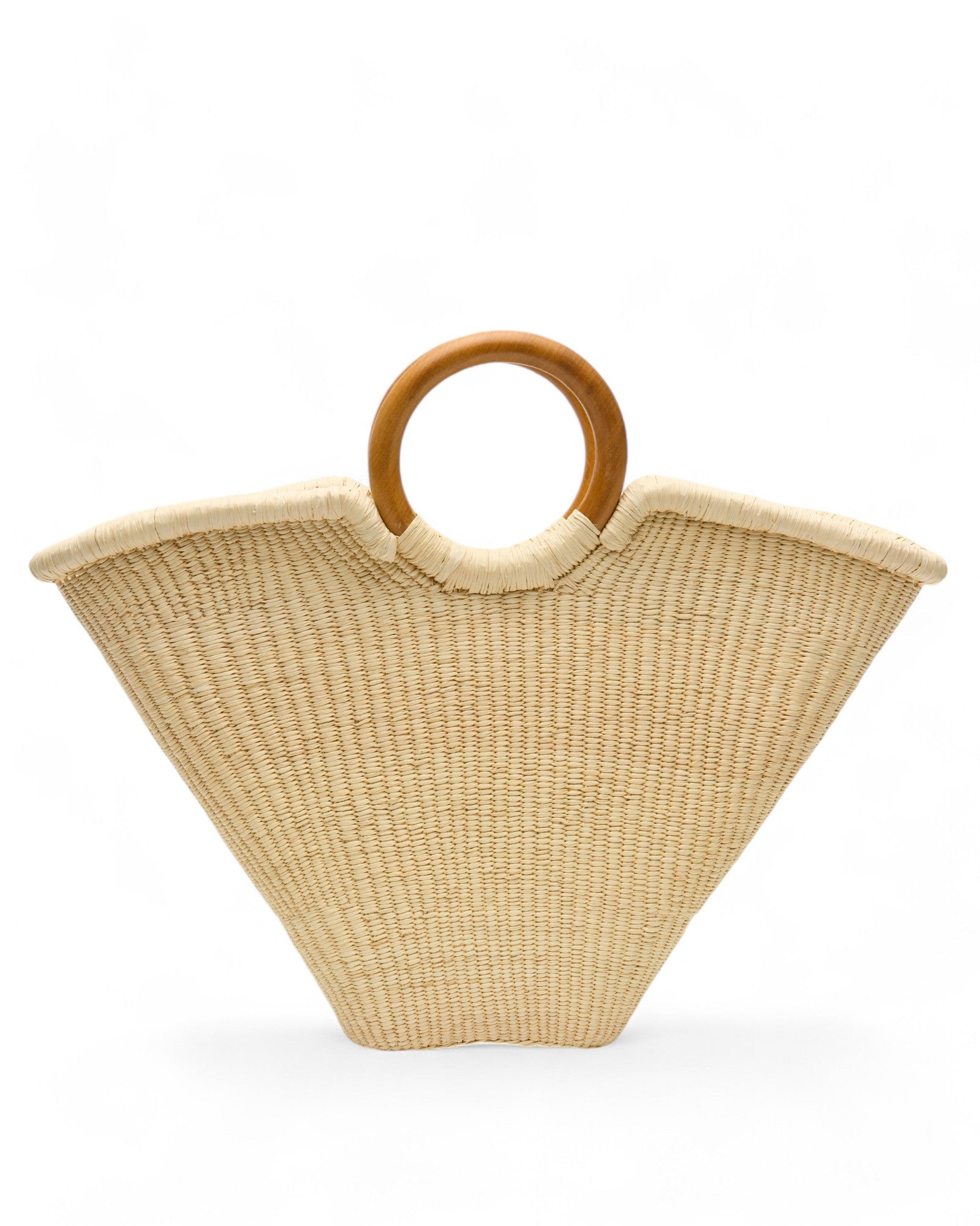 Angled view of the Verano Tote placed upright, showcasing its spacious, unlined interior and strong wooden handles against a plain backdrop.
